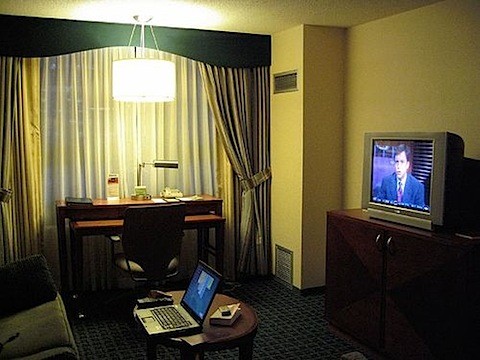 hotel room with old television and laptop