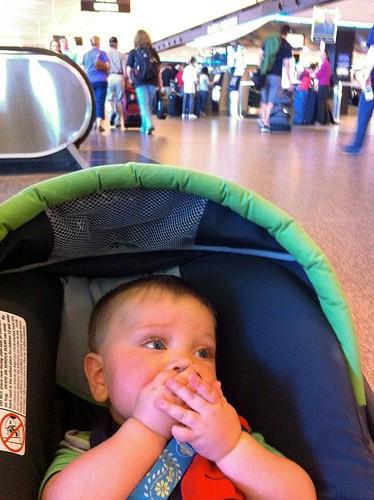 baby in a stroller at the airport