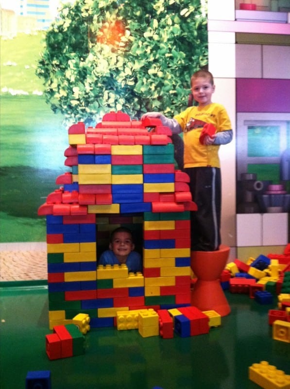 2 boys building Lego house