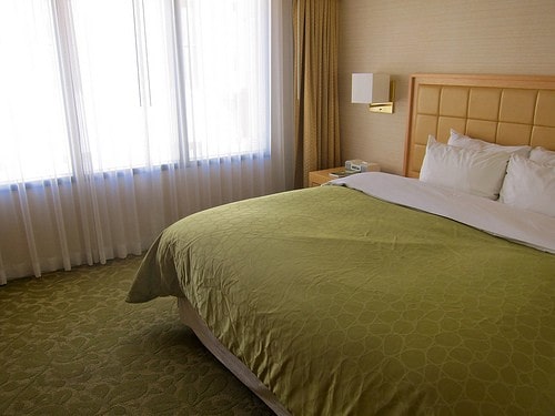 room in green mattress and carpet
